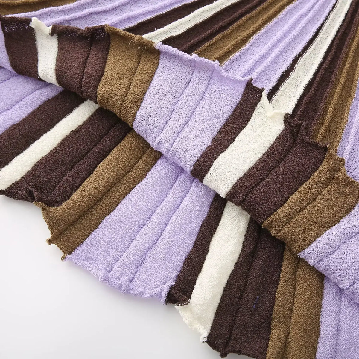 Close-up of lavender brown striped flared skirt hem