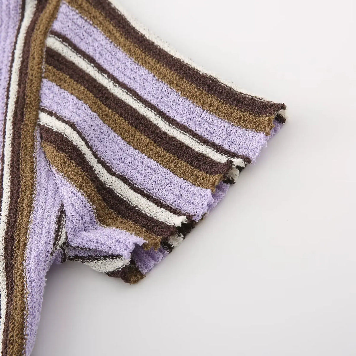 Close-up of lavender brown striped short sleeve cuff