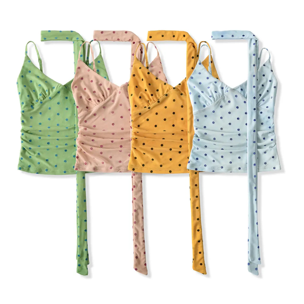 Set of five polka dot tops in green, pink, yellow, orange, and blue on a white background