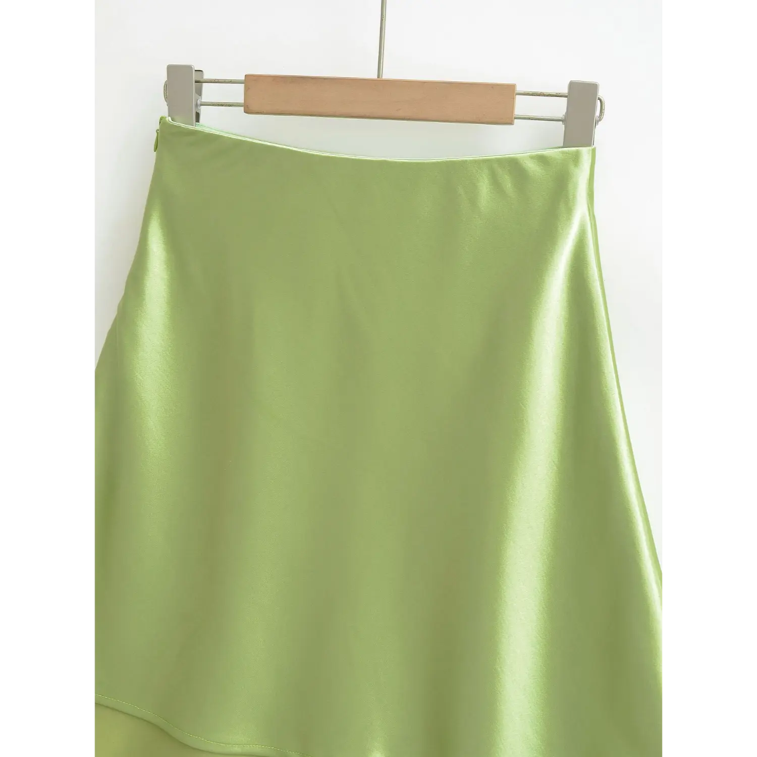 Complete skirt shot of avocado green satin midi skirt, natural soft luster, smooth flowing A-line hem silhouette
