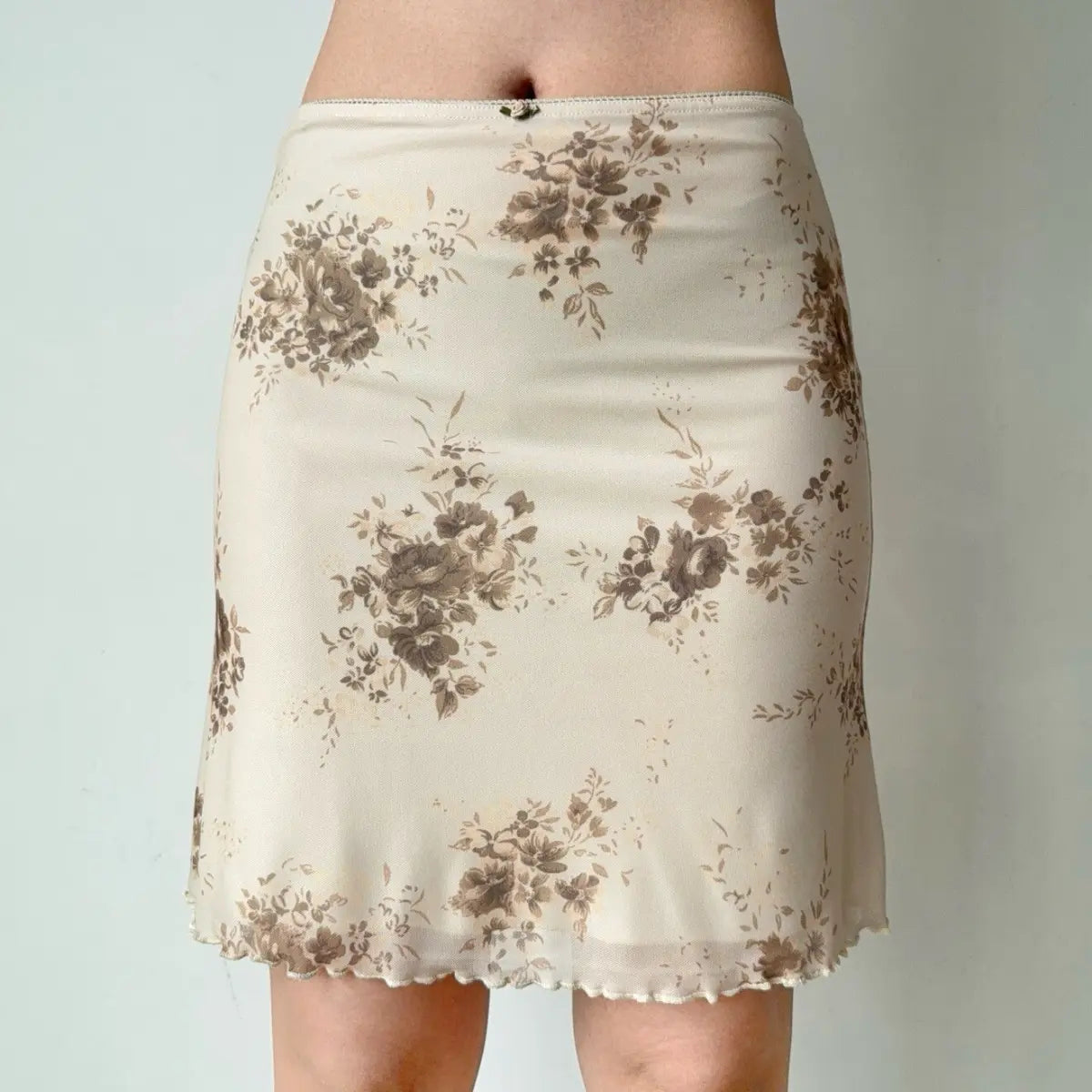 Close-up of beige floral mesh skirt