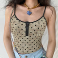 Model wearing beige polka dot Henley cami tank top