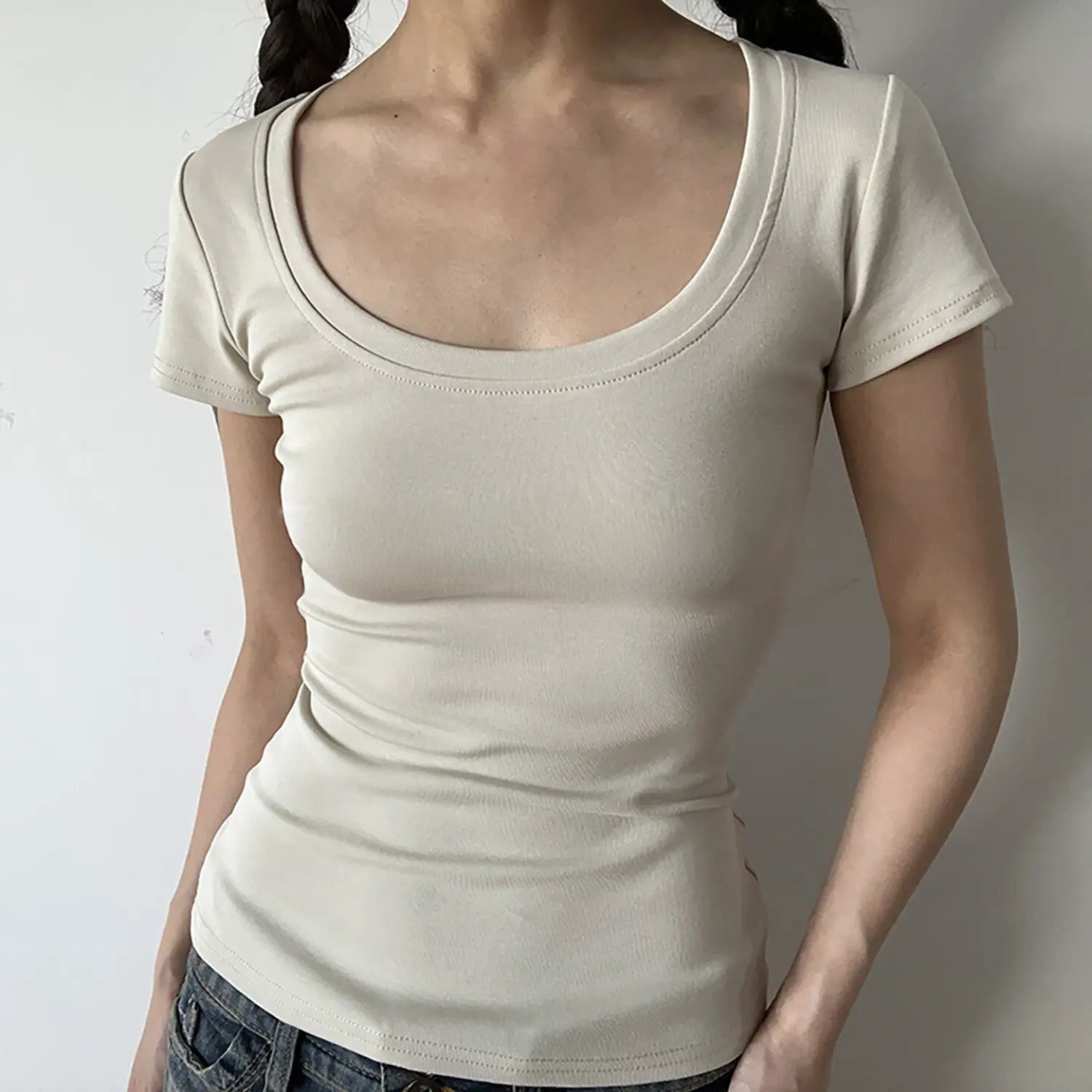 Front model shot of cream beige U-neck slim fit ribbed short sleeve top