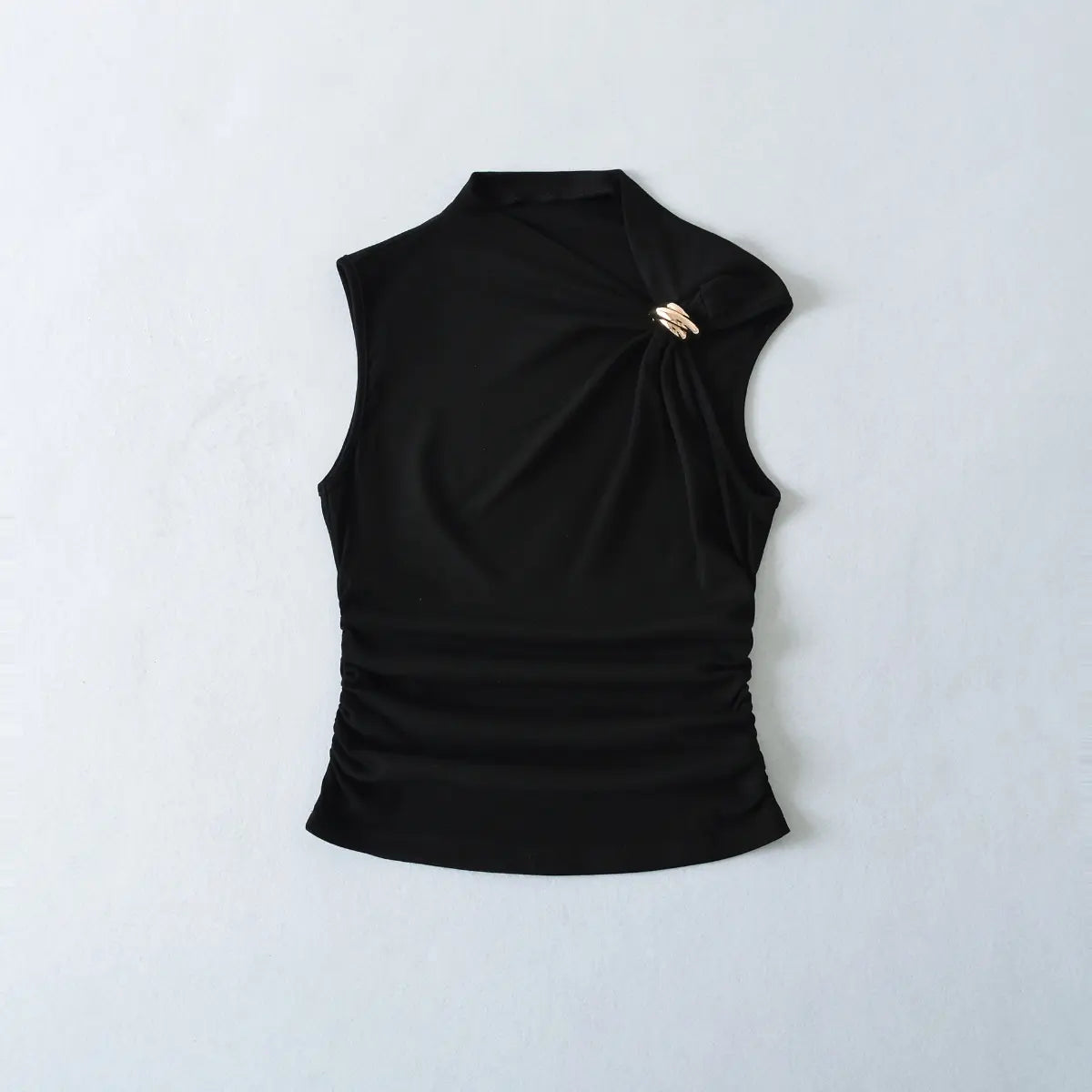 Front view of black tank top with gold metal ring and side ruching