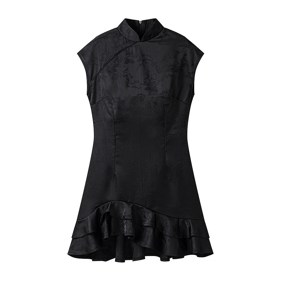 Hanger view of black jacquard dress showing the mandarin collar, diagonal placket, and ruffled hem detail
