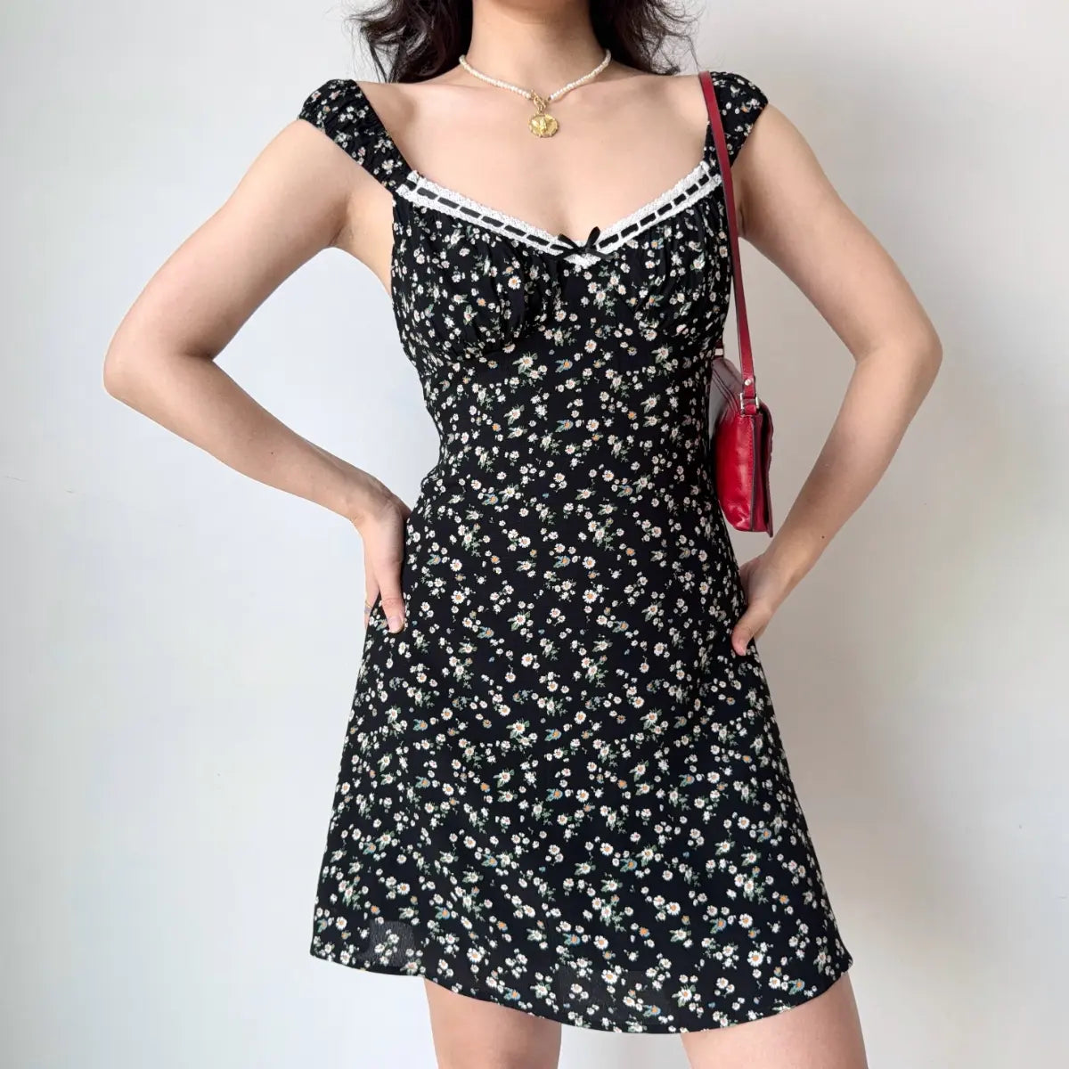 Full front view of black floral mini dress