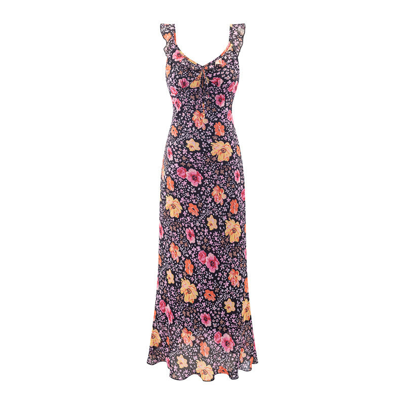 Front view of black floral cami maxi dress with ruffled straps and flowy skirt