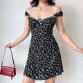 Off-shoulder view of black floral mini dress