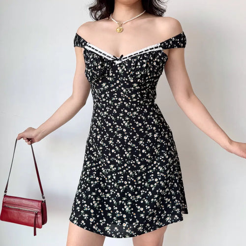 Off-shoulder view of black floral mini dress