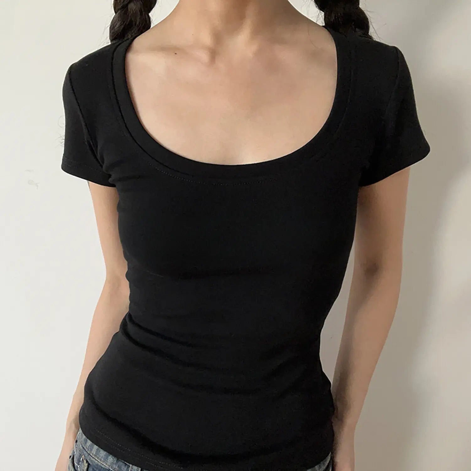 Front close-up of black deep U-neck stretch ribbed bodycon short sleeve t-shirt