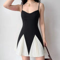 Black and white colorblock cami dress with sweetheart neckline and pleated hem
