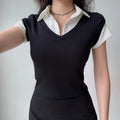 Outfit view of black preppy dress, highlighting the form-fitting silhouette and classic school-inspired look