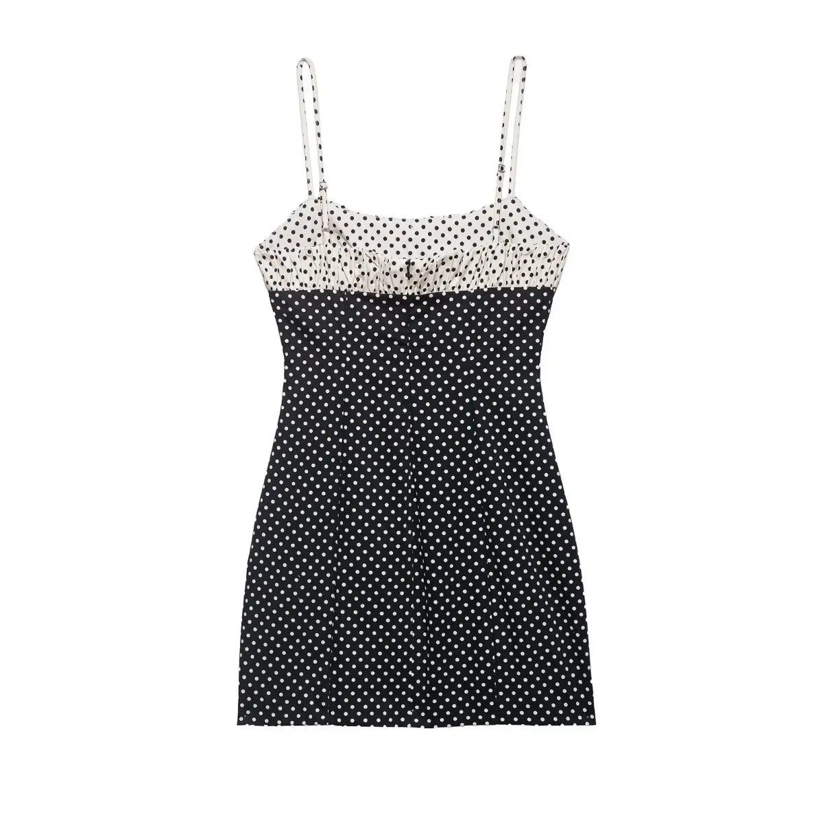 Back view of black and white polka dot cami dress with contrast smocked panel