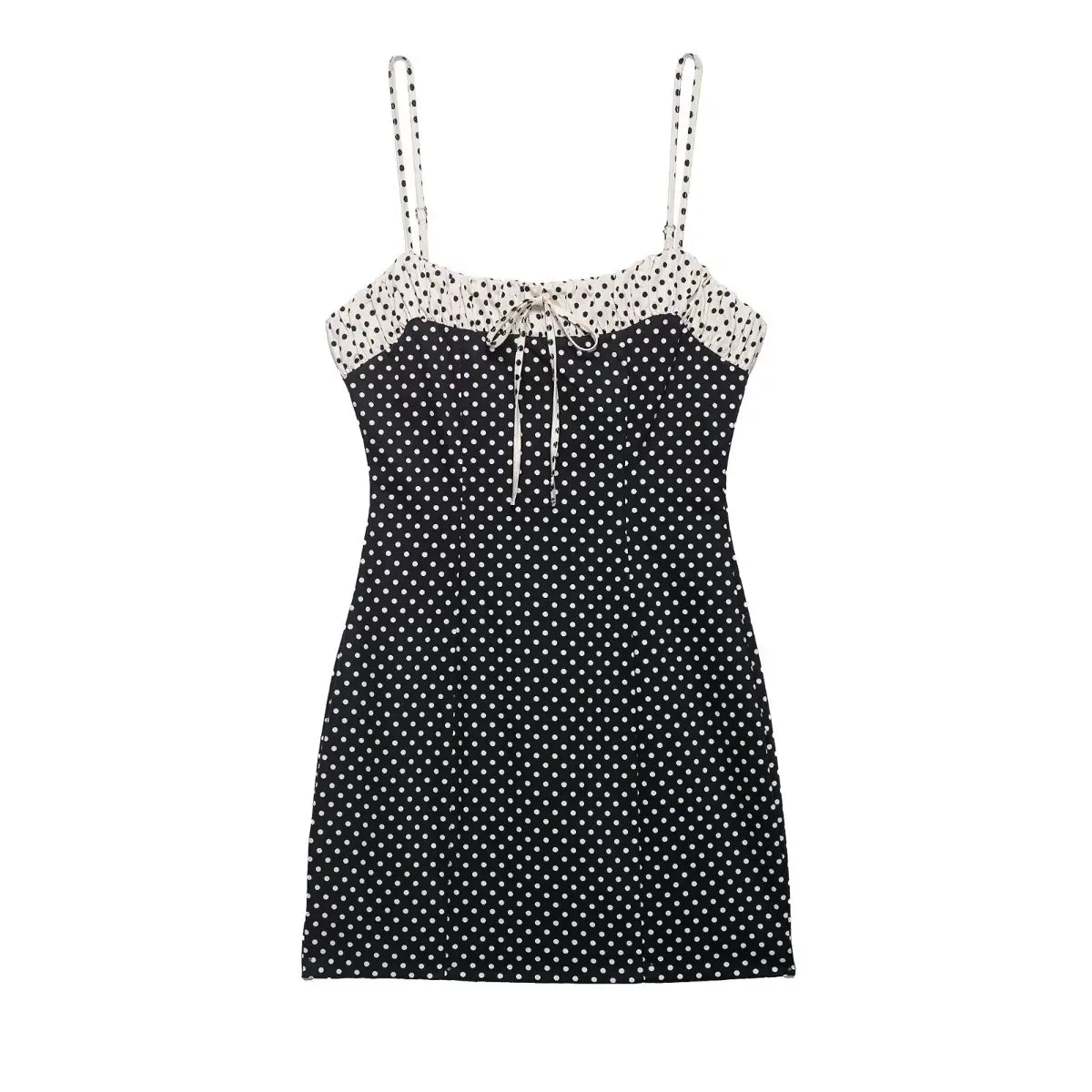 Front view of black and white polka dot cami mini dress with contrast smocked top and tie detail