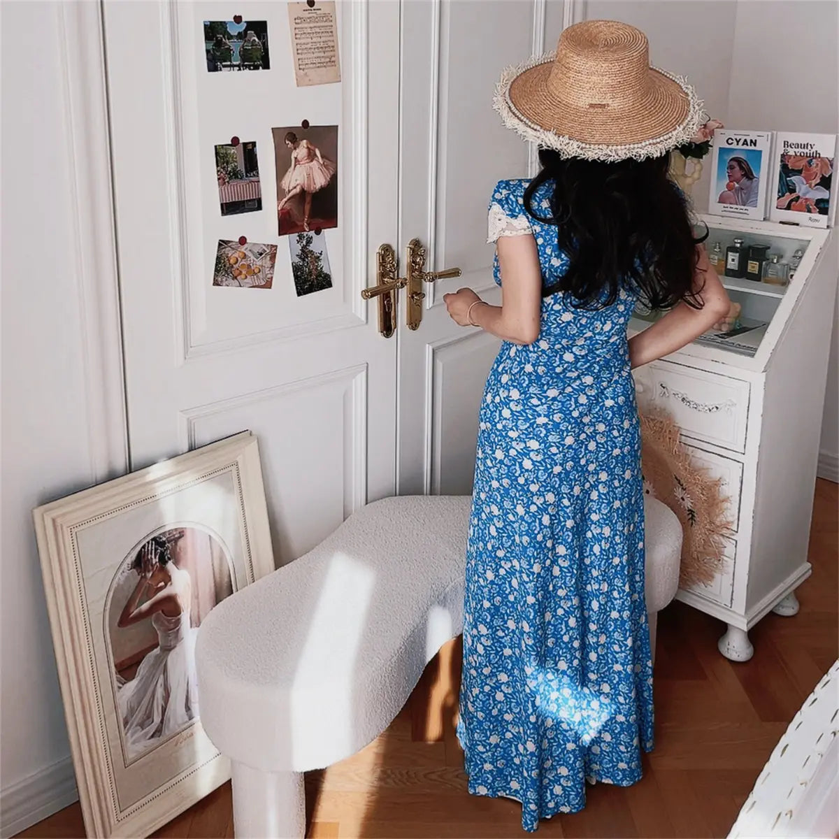 Model in blue ditsy floral lace-trim maxi dress, back view