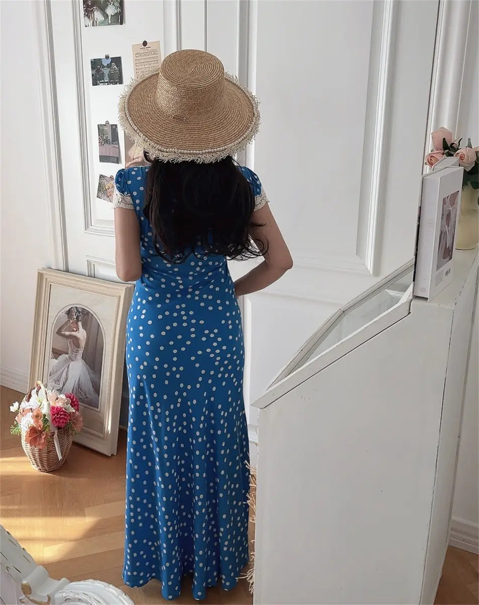 Model in blue ditsy print lace-trim maxi dress, back view