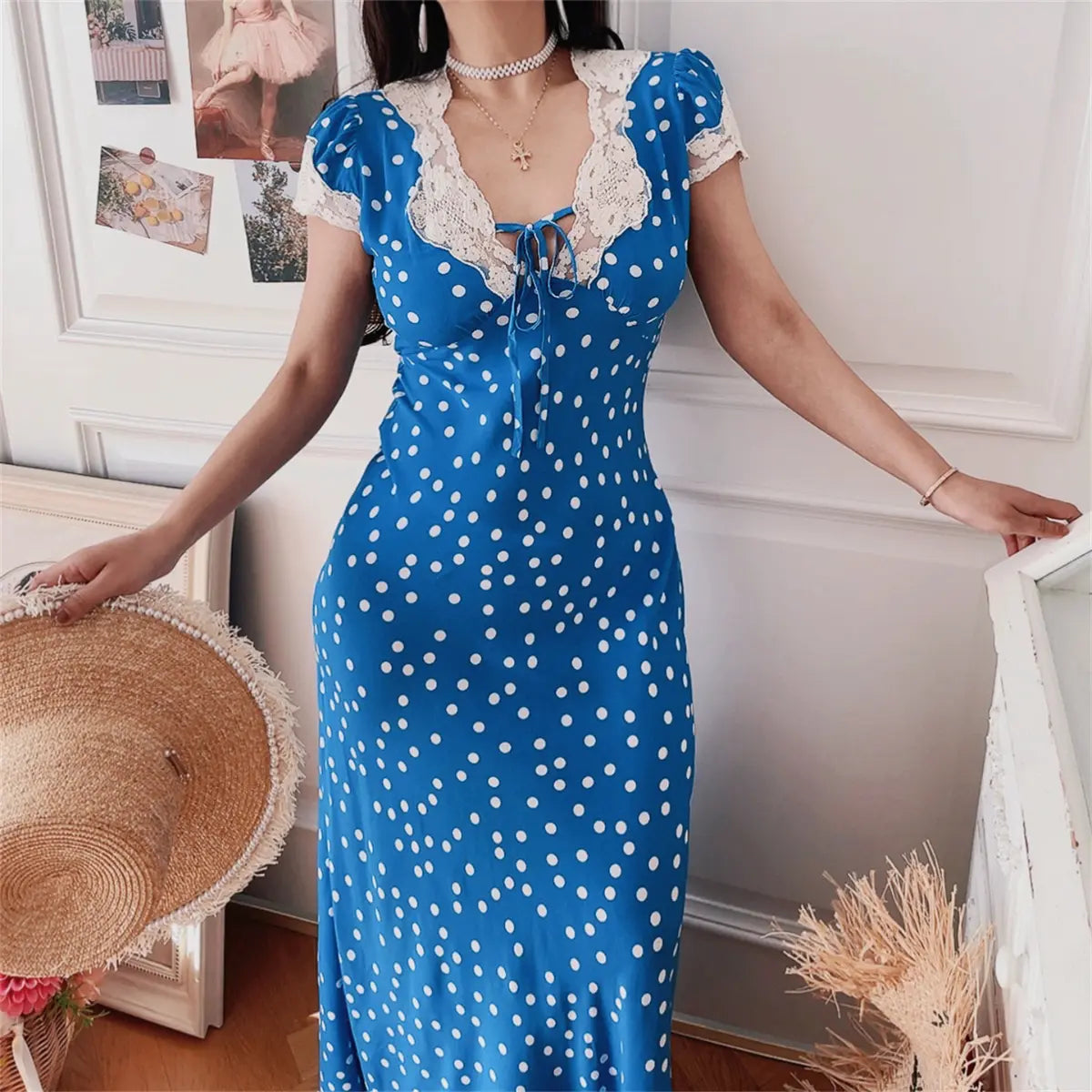 Close-up of blue ditsy print lace-trim maxi dress on model