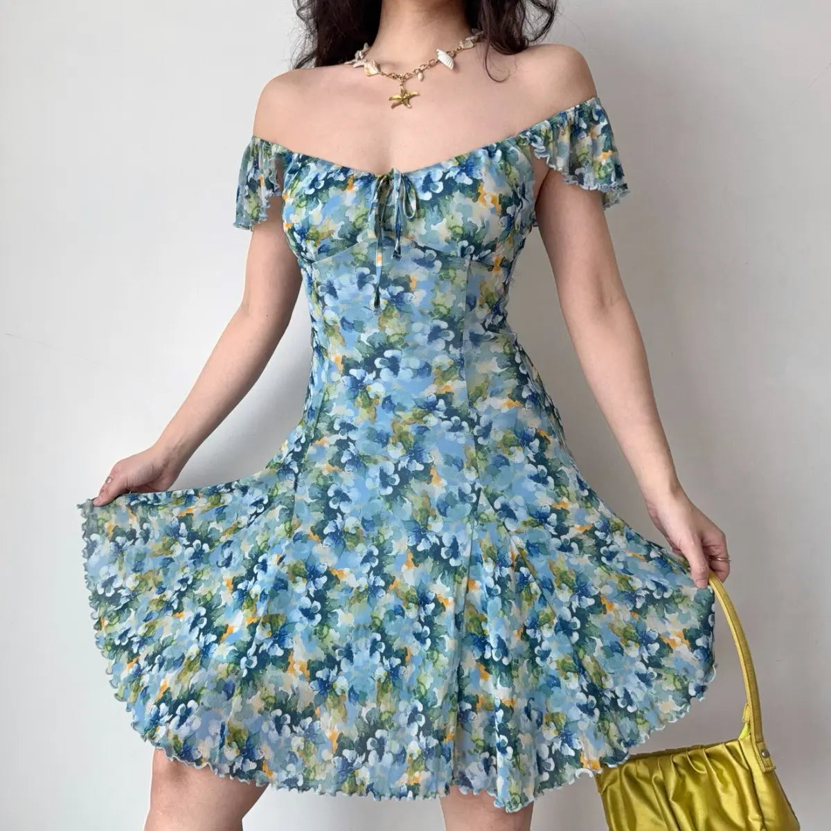 Off-shoulder view of blue floral mini dress