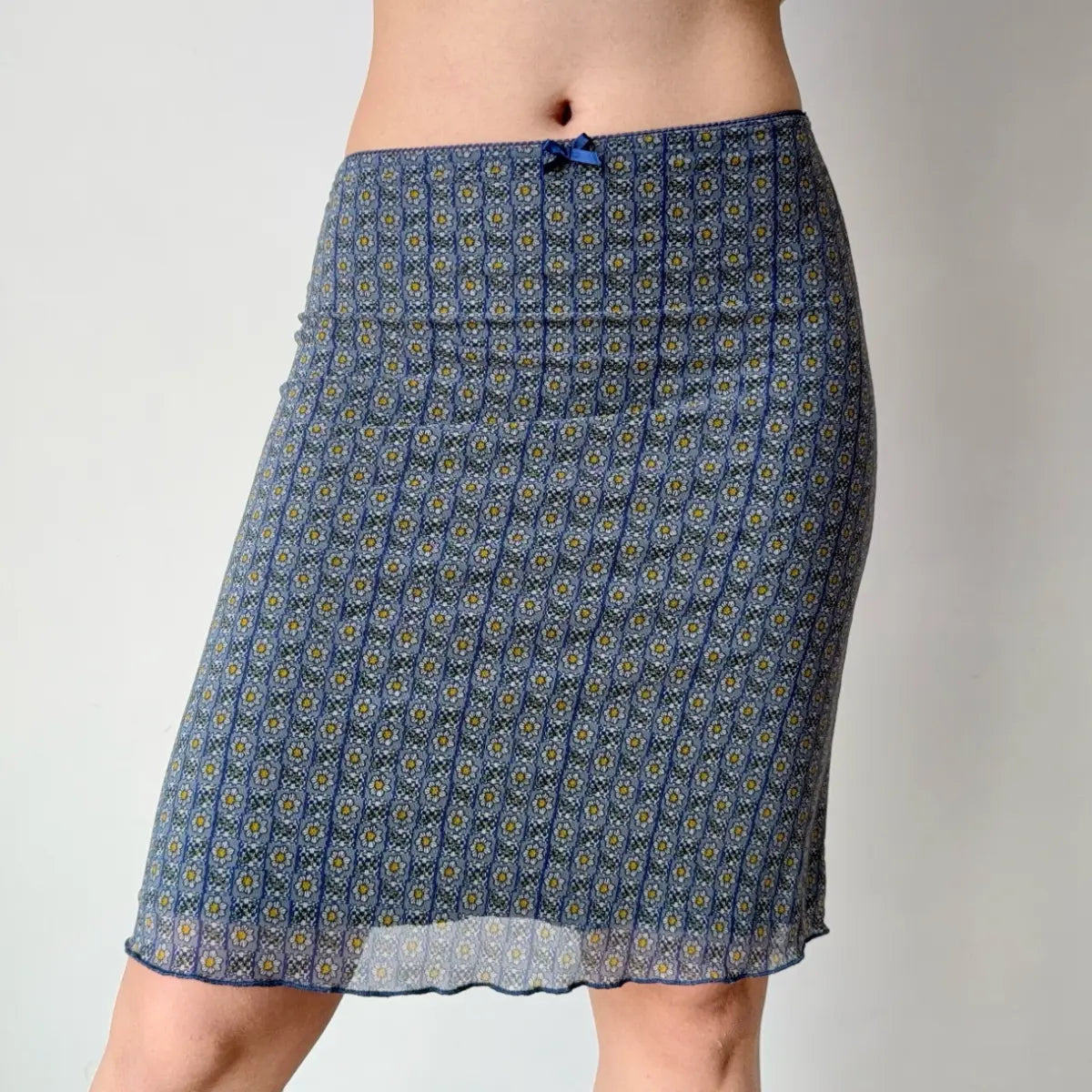 Side view of blue floral mesh midi skirt