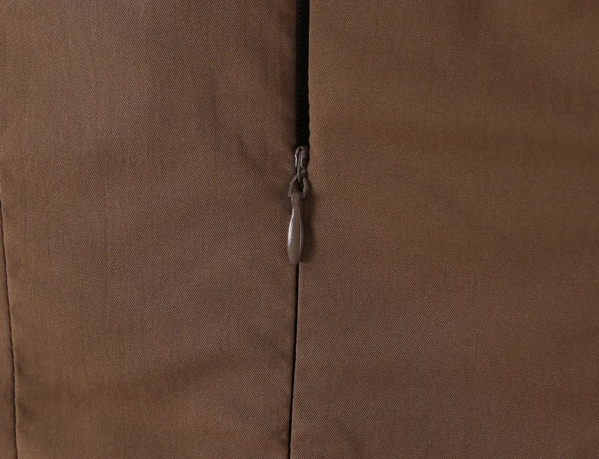 Close-up of the invisible back zipper closure on the brown cami dress
