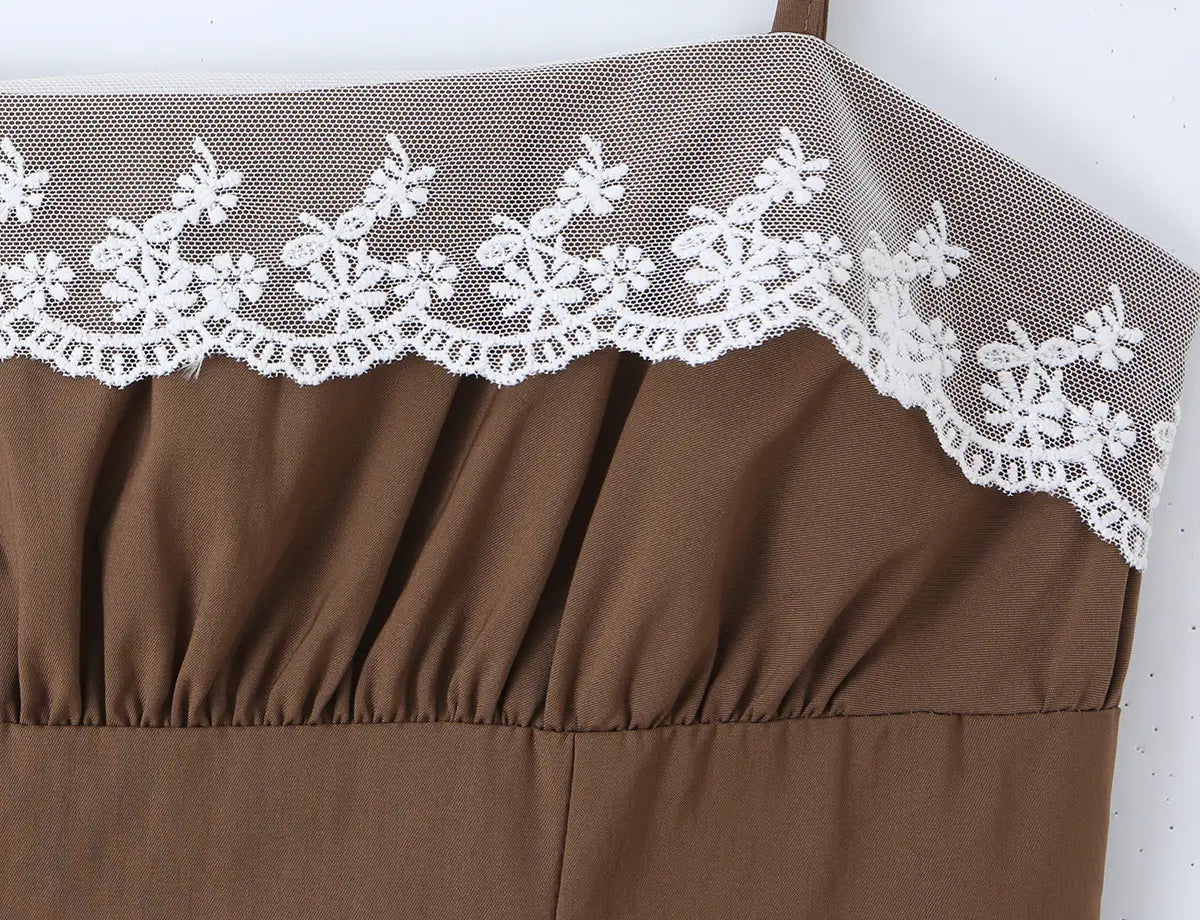 Close-up of the white floral lace trim at the bustline, highlighting the delicate embroidery pattern