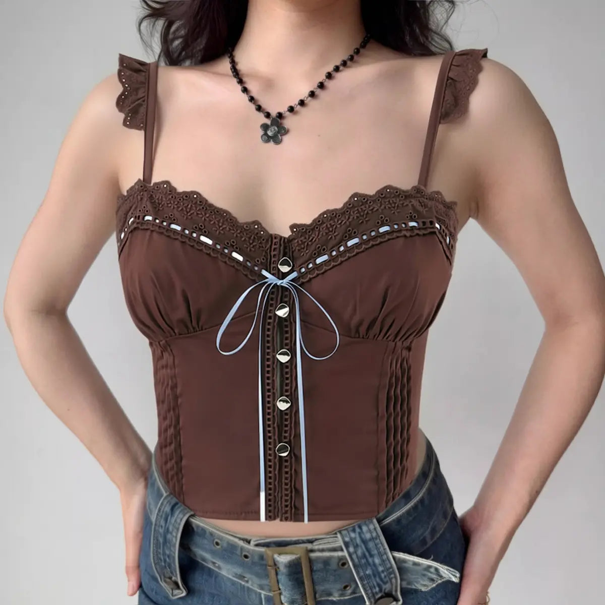 Woman wearing brown lace-trim cami corset top, front view with jeans