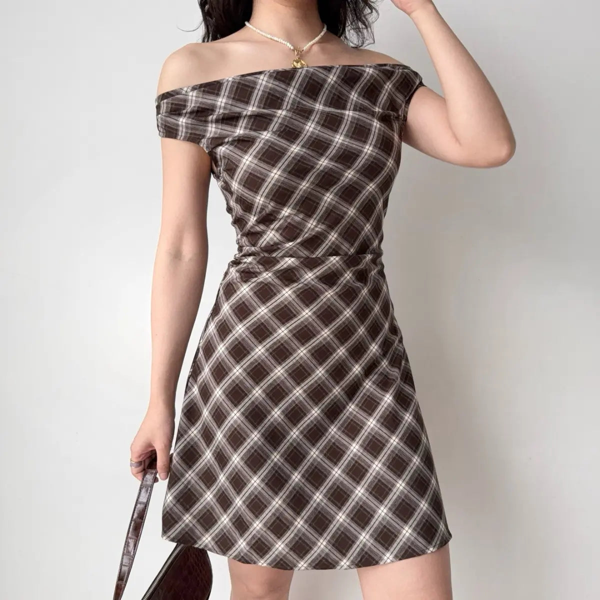 Brown plaid off-shoulder dress, arm up view
