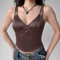 Brown satin corset top styled with jeans