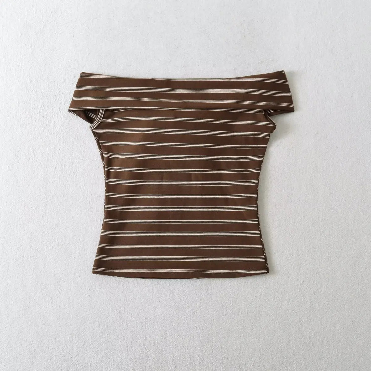 Close-up view of brown striped tube top showing front bow tie detail and ribbed fabric