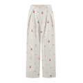 Flat front product shot of cream high waist pleated wide leg trousers, all over cherry & tiny heart print, front button fly design