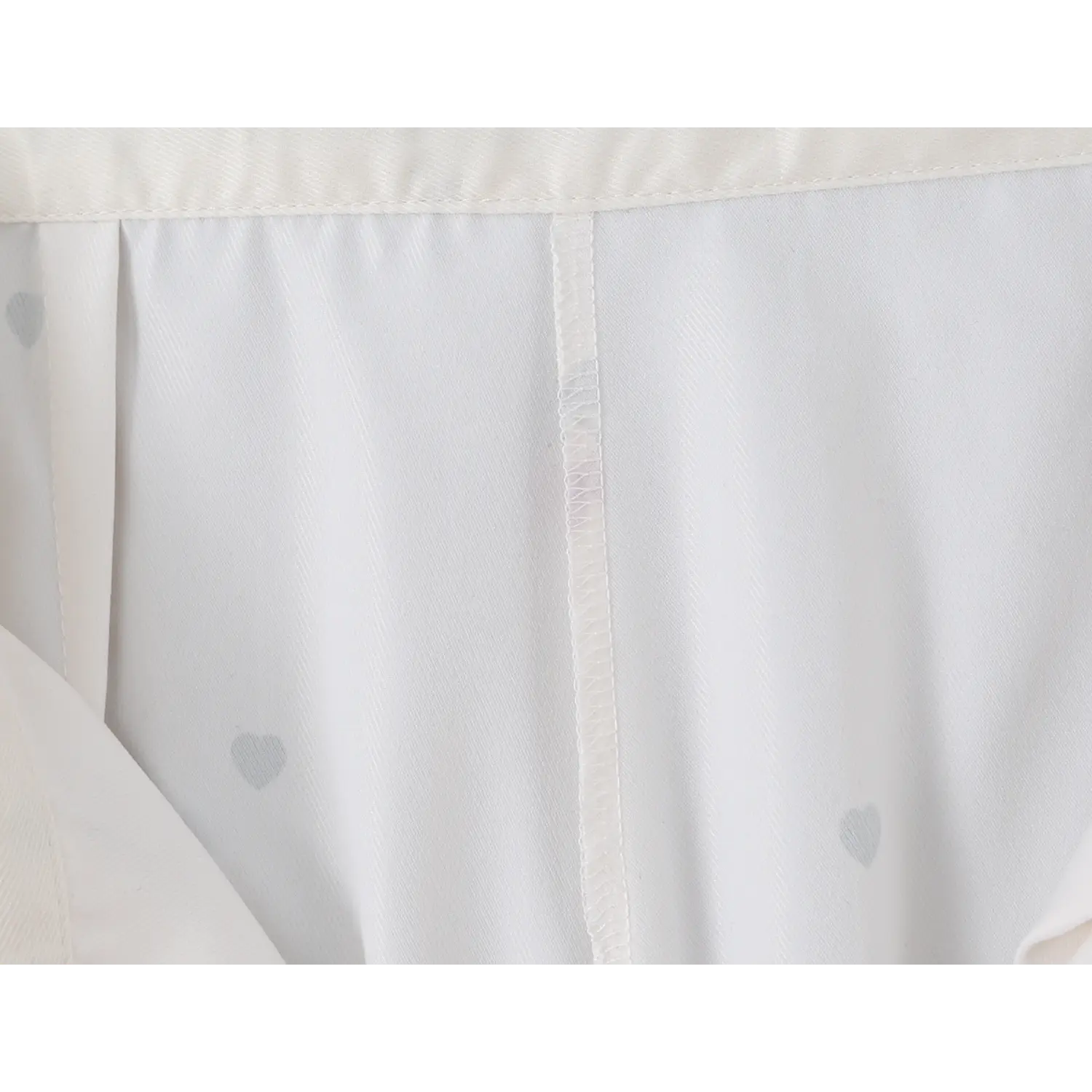 Inside waistband lining close-up, neat vertical serged stitching and lightweight full lining fabric