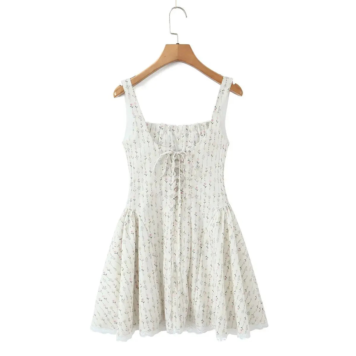 Back view of cream ditsy floral cami mini dress with lace-up corset detail, on hanger