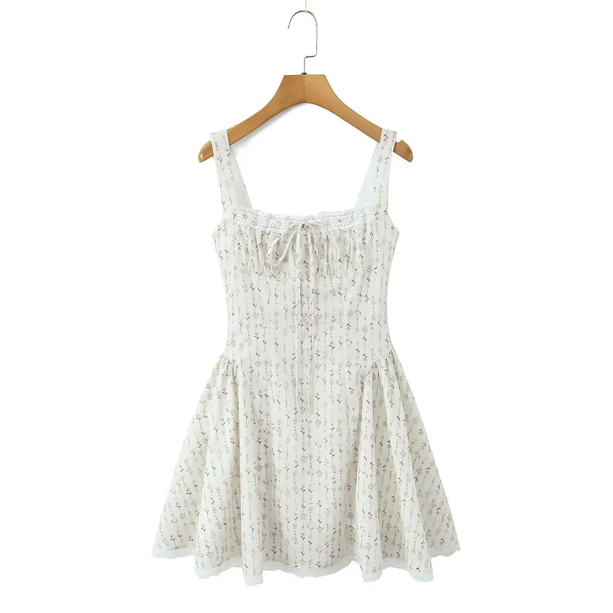 Front view of cream ditsy floral cami mini dress with lace-up detail, on hanger
