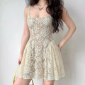 Model wearing cream white floral lace spaghetti-strap mini dress, semi-sheer romantic party dress