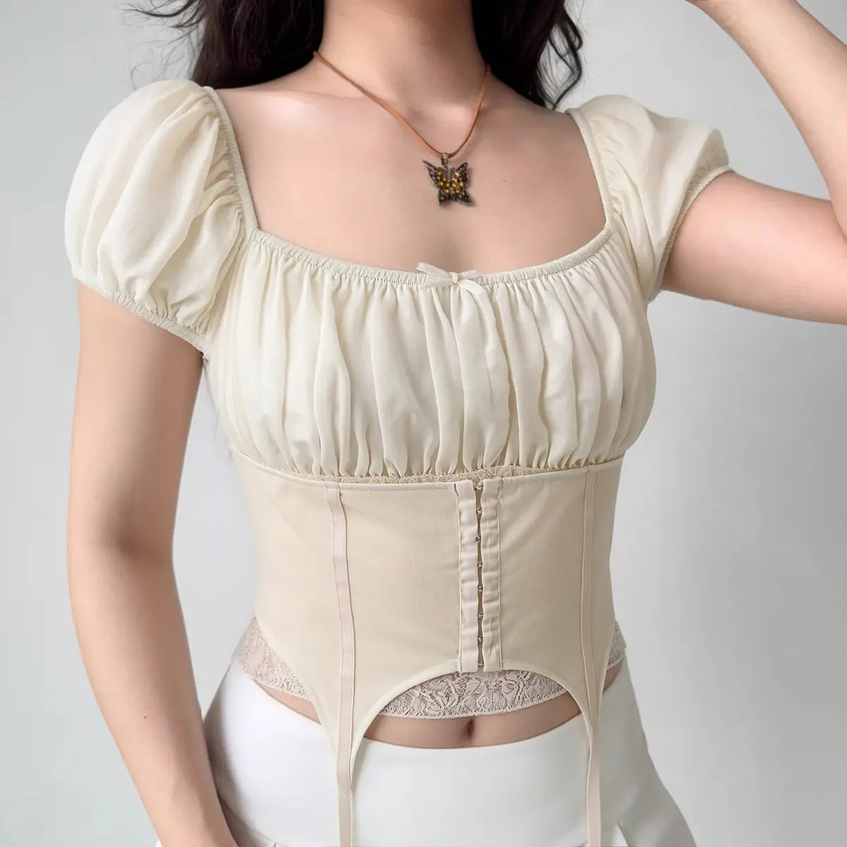 Cream white puff sleeve corset top with lace trim