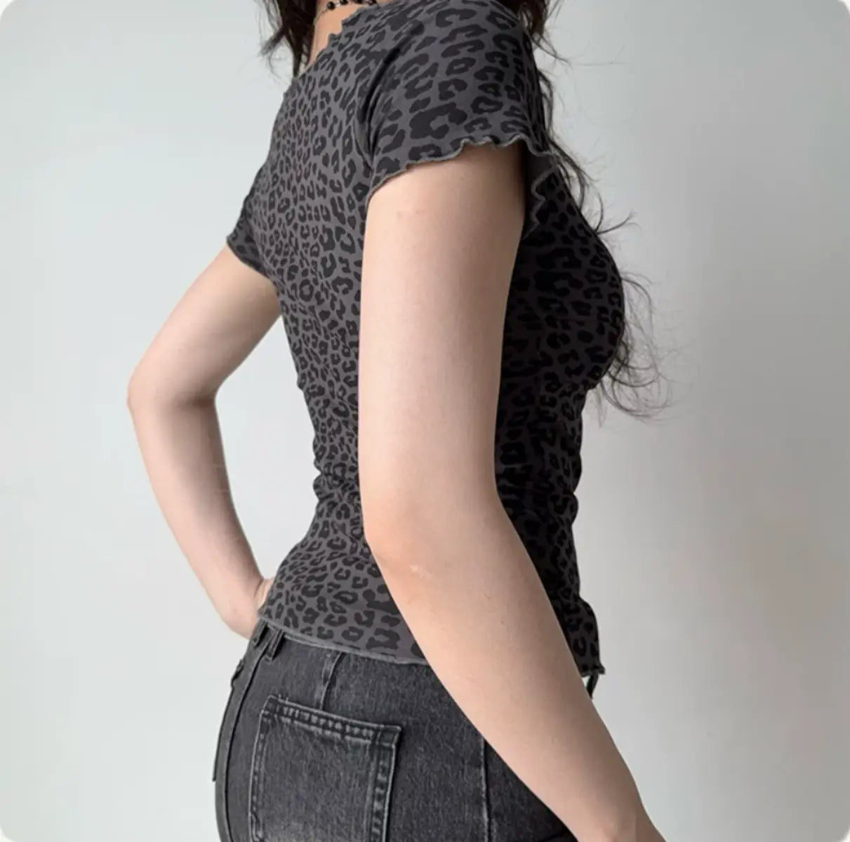 Back view of dark gray leopard print top showing the fitted silhouette and short sleeves