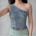 Model wearing denim one-shoulder corset top with acid-wash finish, edgy Y2K-inspired cropped bustier