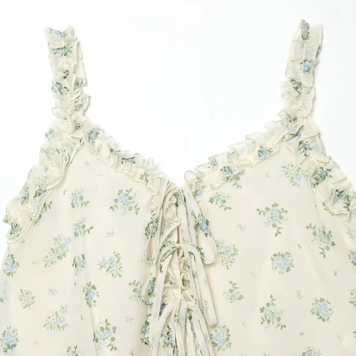 V-neck partial close-up, chiffon ruffle trim, front multi-layer lace-up drawstring detail, scattered blue floral print