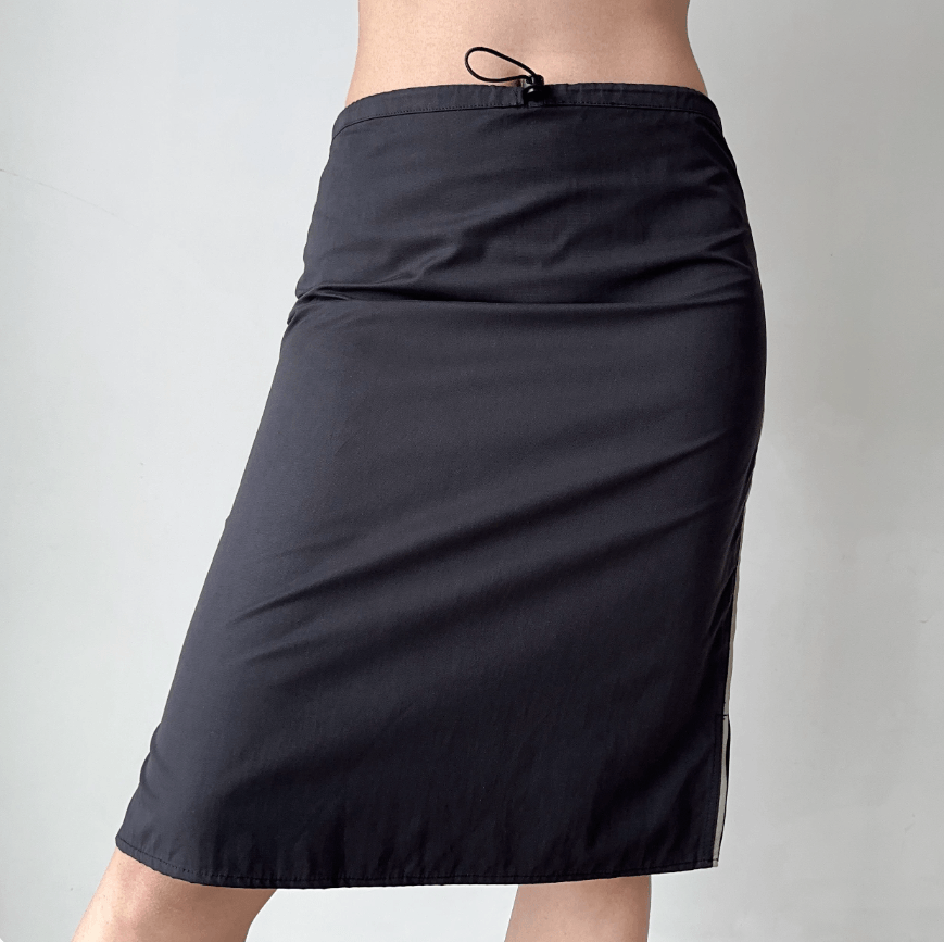 Side front view black drawstring high waist midi skirt, contrast side stripe slit slim fit straight casual mid length skirt