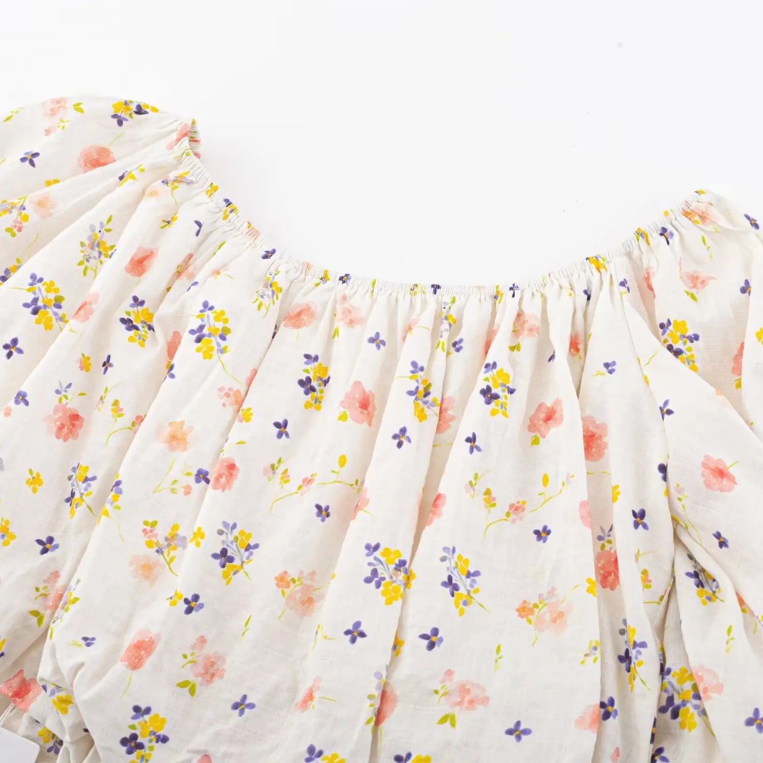 Wide boat neck full elastic gathering detail, loose off-shoulder silhouette all over ditsy floral print