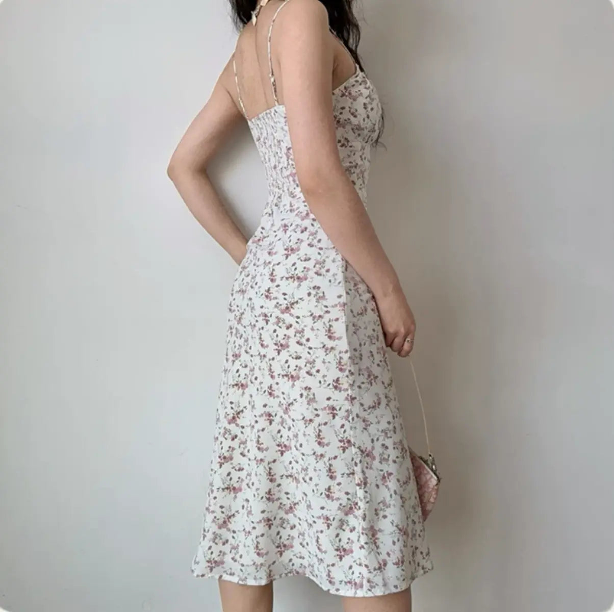 Back-side view of ditsy floral midi dress
