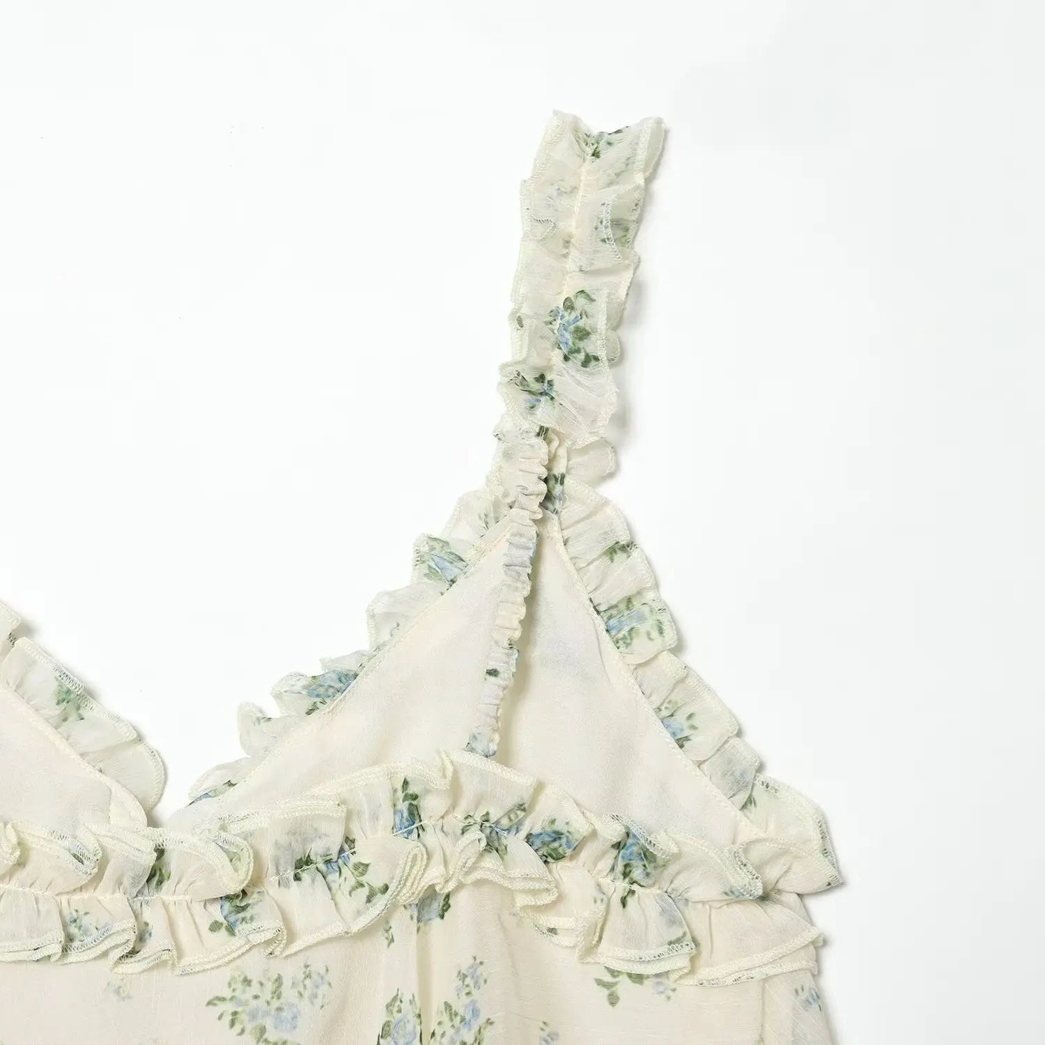 Back ruffle strap partial shot, elastic shirred construction, all-over tiny blue flower print