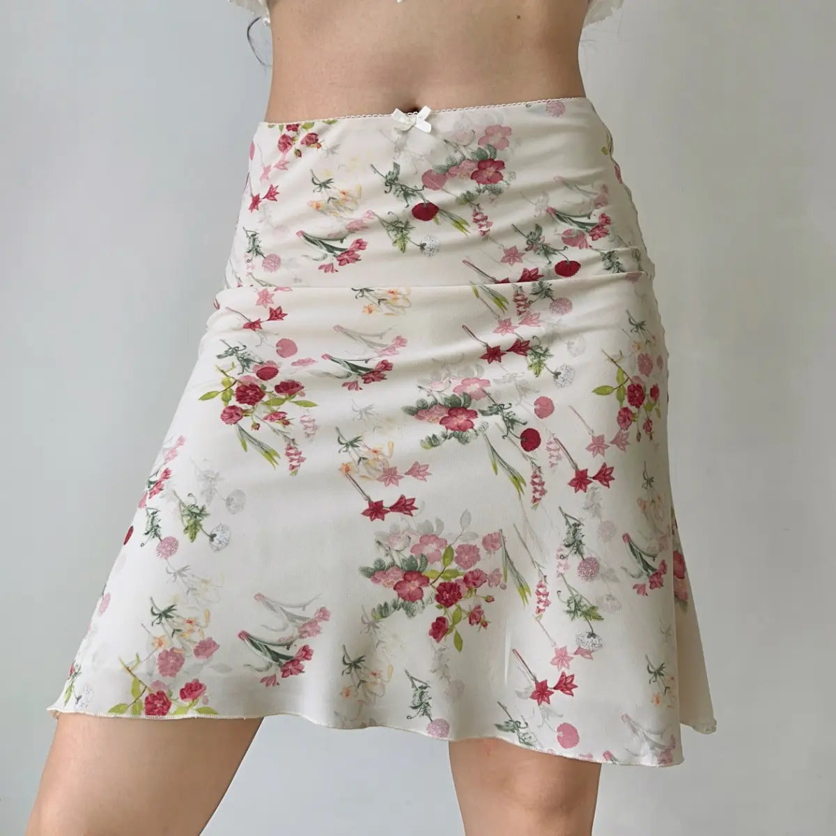 Side view of cream pink floral midi skirt
