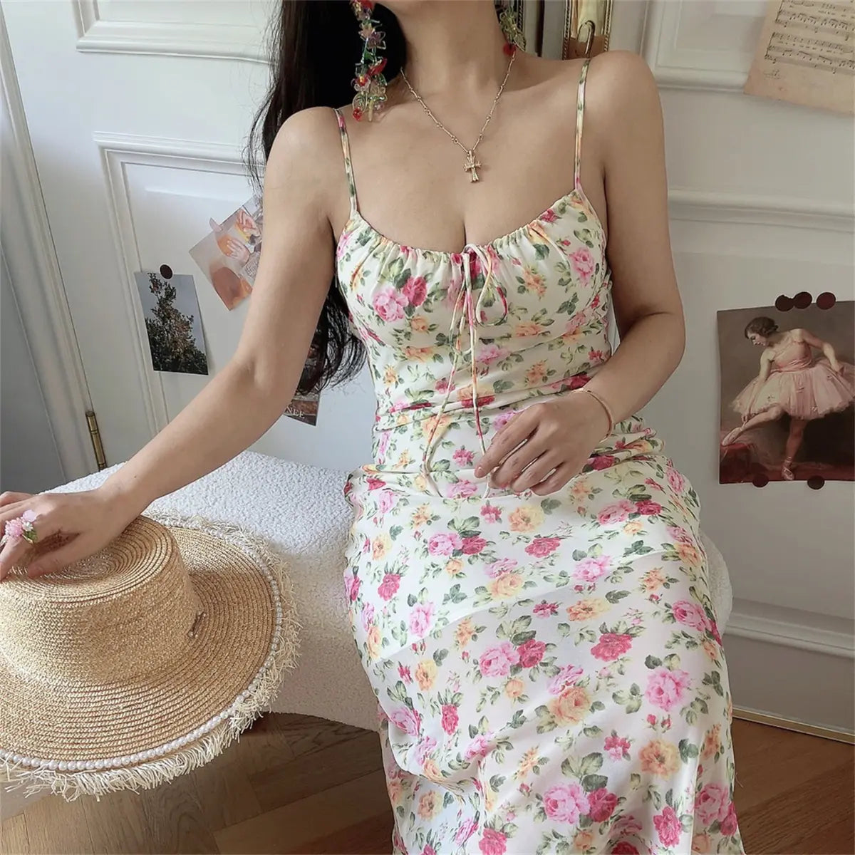 Close-up of model wearing floral print spaghetti strap maxi dress