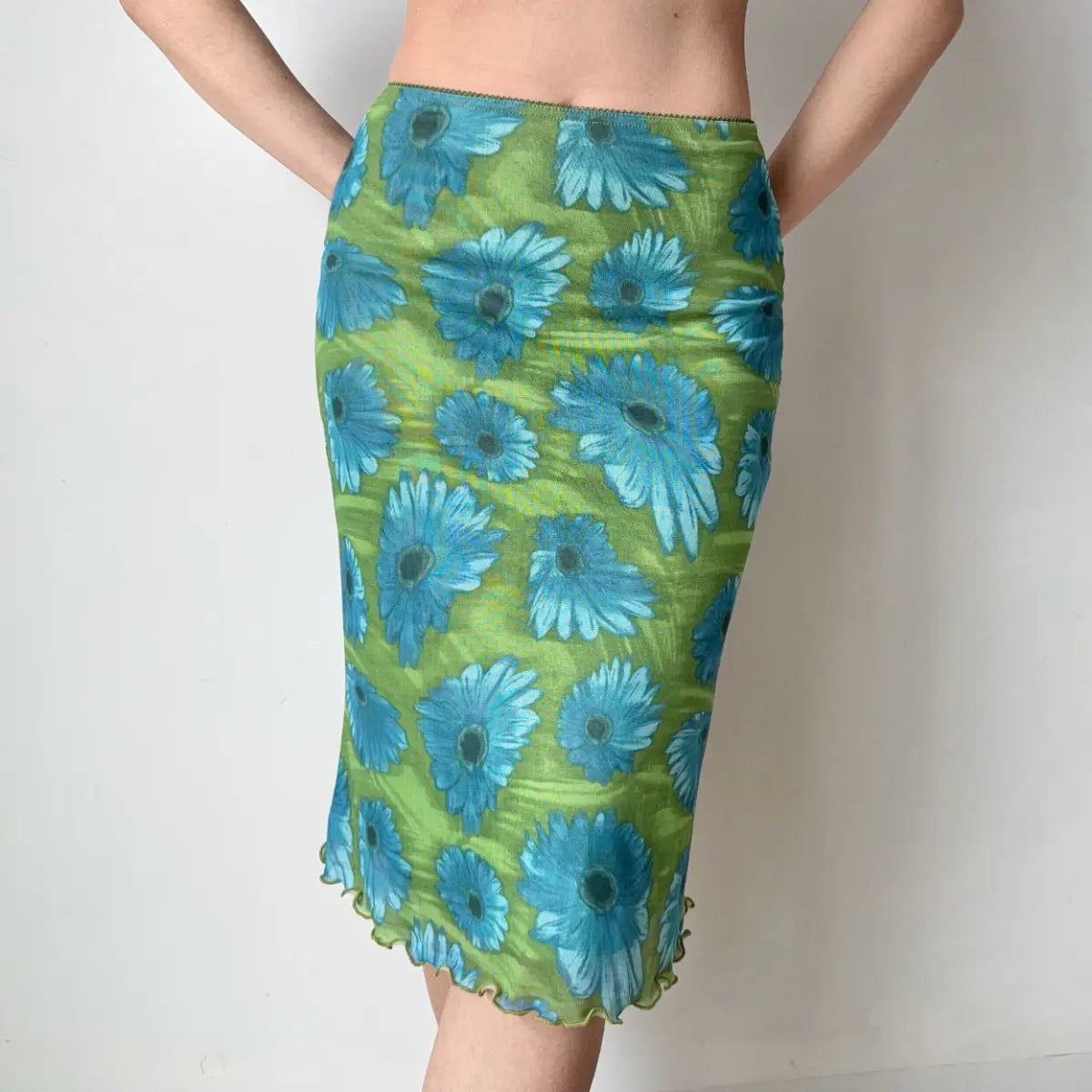 Green floral midi skirt, hands behind back view