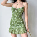 Side view of green butterfly print mini dress