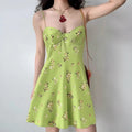 Model wearing green floral-print cami dress with sweetheart neckline, flowy A-line mini dress