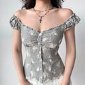 Grey striped top styled as off-the-shoulder