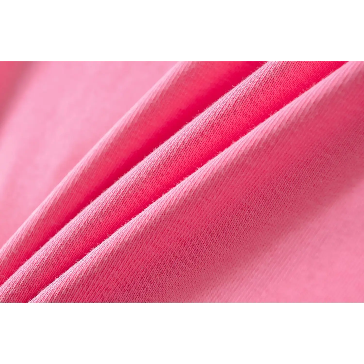 Macro texture shot of soft stretch ribbed knit fabric for hot pink U-neck basic fitted t-shirt