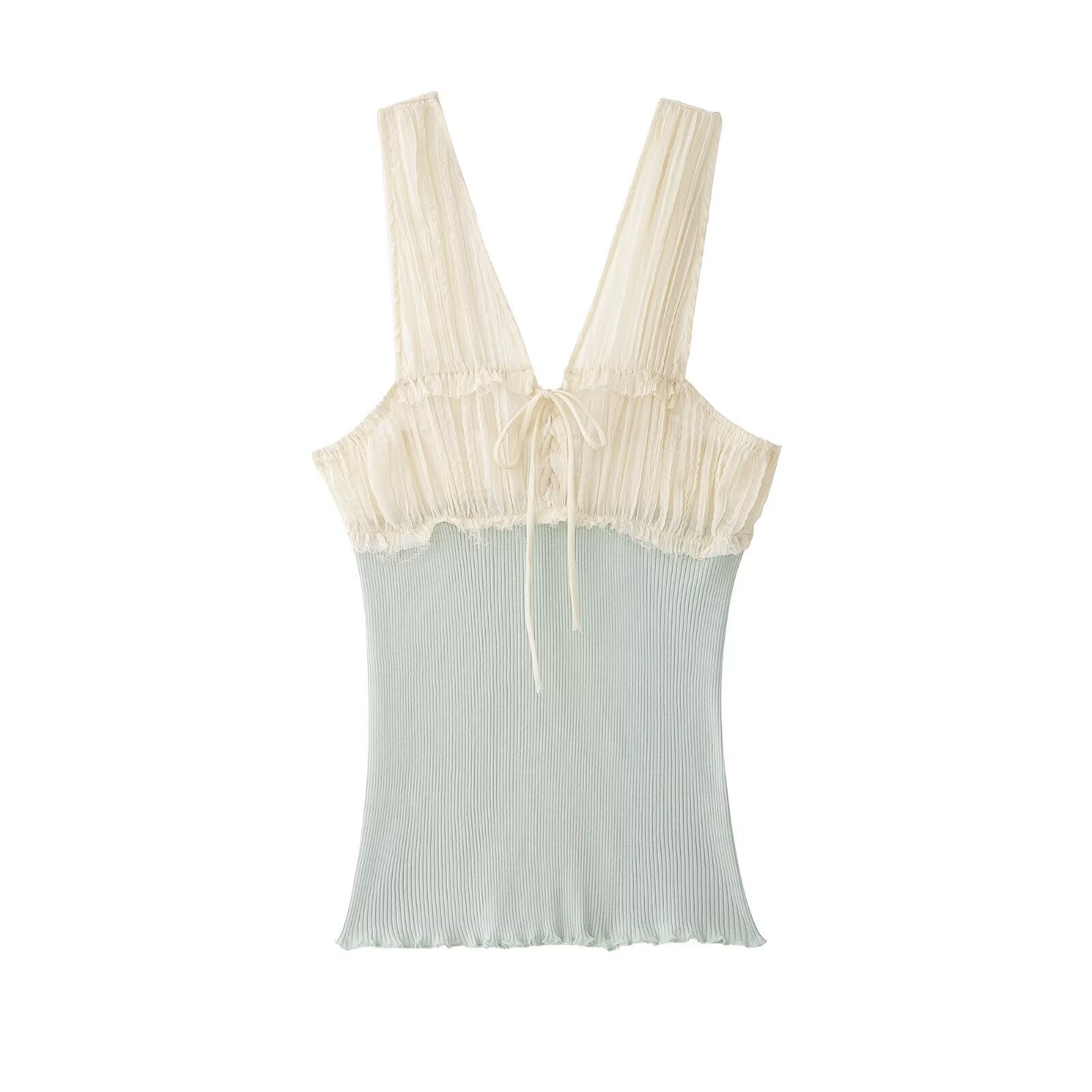Hanger view of cream and mint green tank top showing the lace-trimmed bustier-style bodice and contrast color-block design